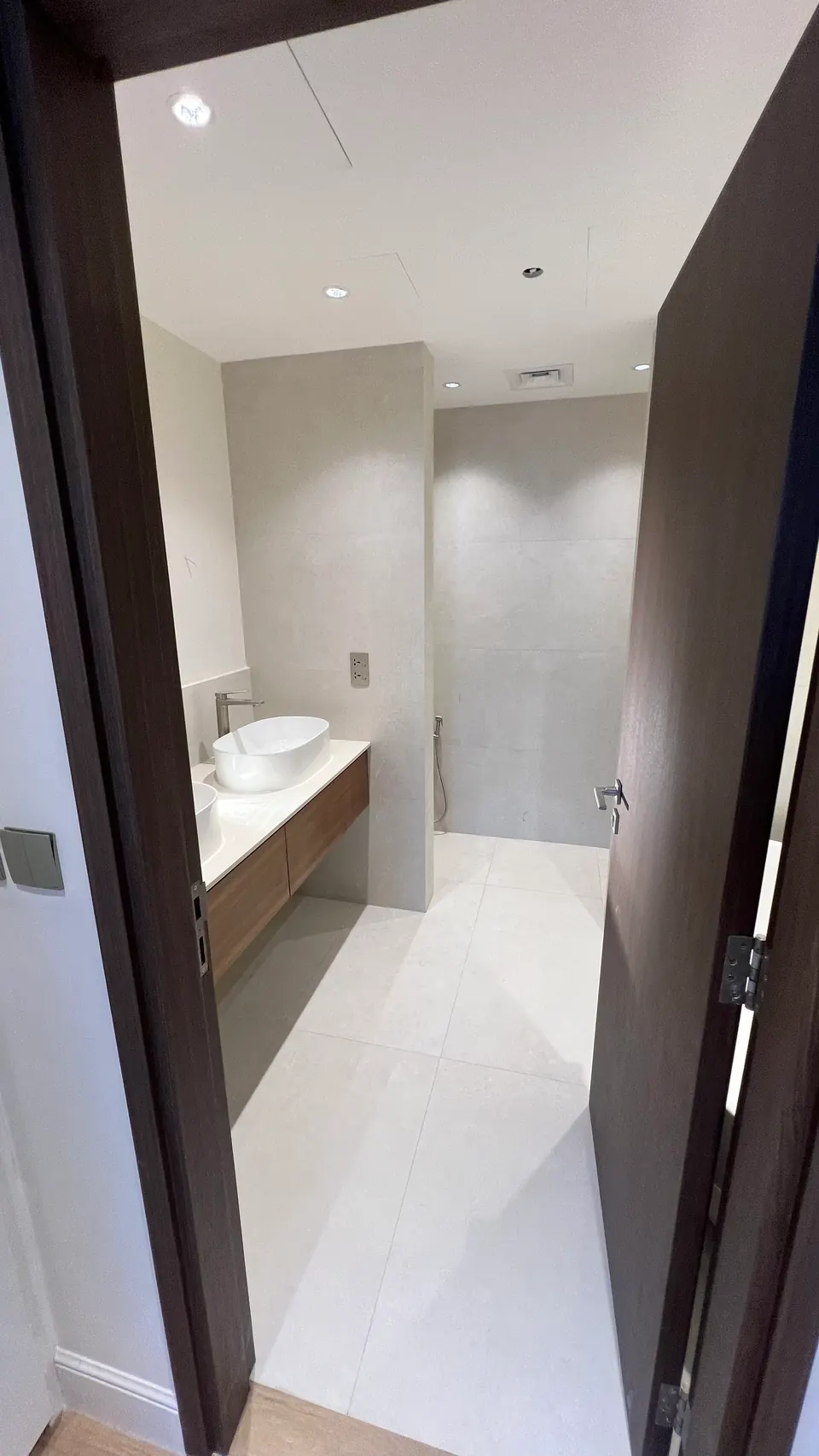 Bathroom with a wood vanity and a vessel basin, City Walk
