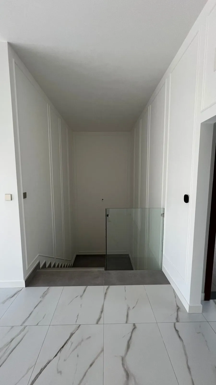 Hallway with wall mouldings and marble-look tiles, Wadi Al Safa 3